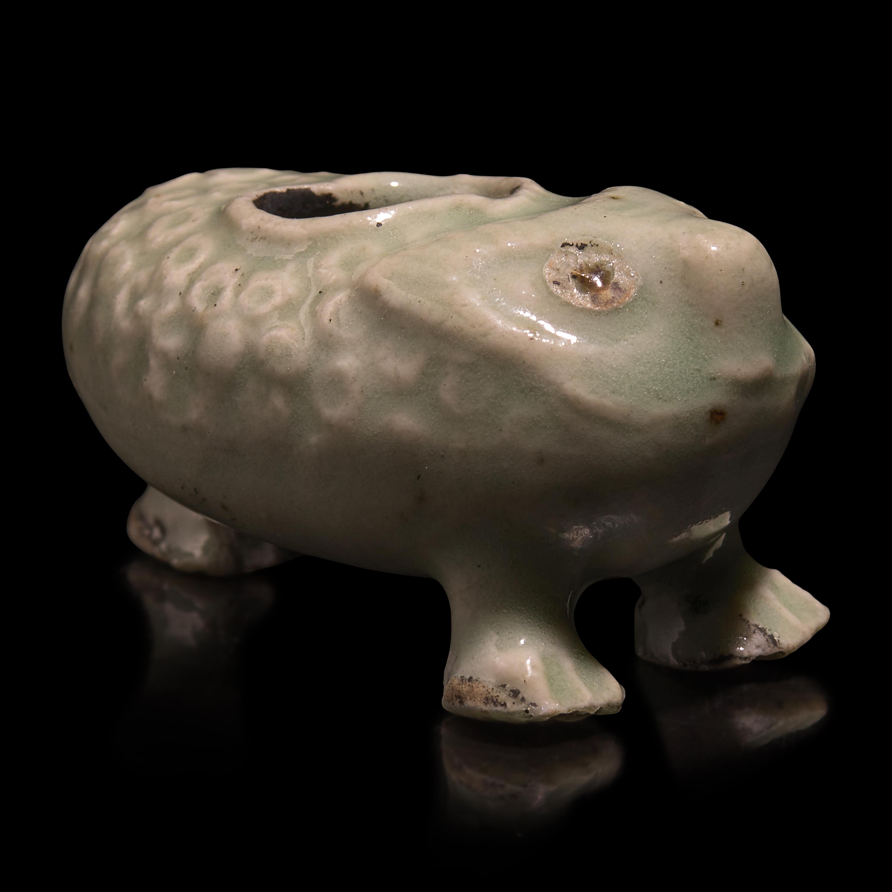 A Chinese Pale Blue Glazed Three-Legged Toad, Yuan/Ming Dynasty or Earlier — 元明或更早 青釉金蟾