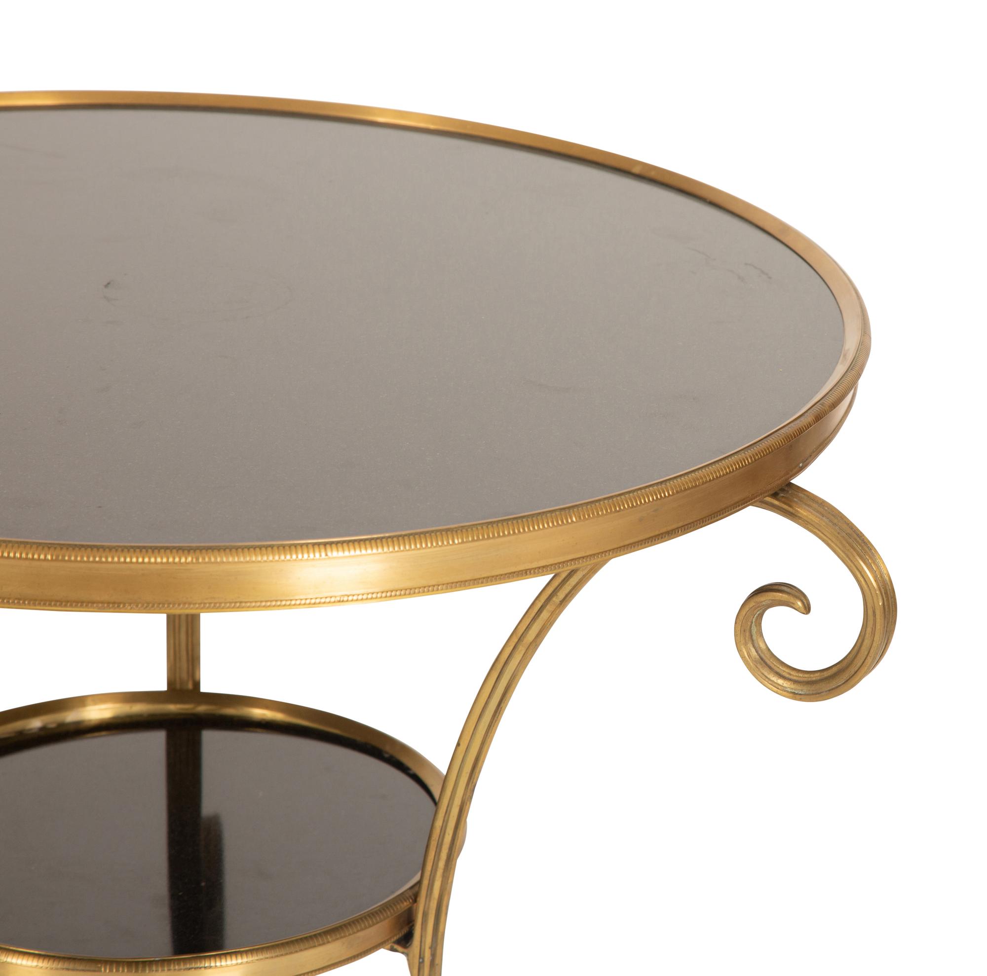 An Empire Style Gilt Metal and Black Granite Guéridon