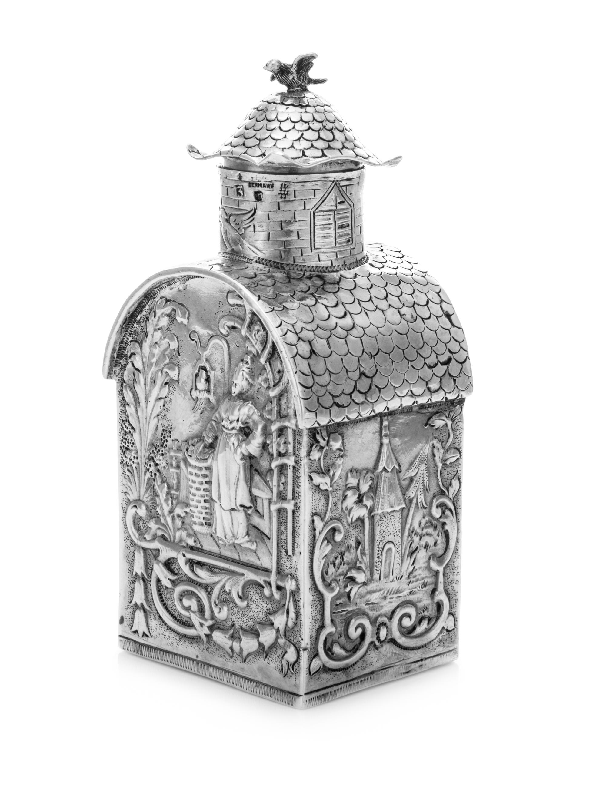 A German Silver Tea Caddy, B. Neresheimer & Sohne, Hanau, Late 19th/Early 20th Century, in the form of a folly building, the body depic