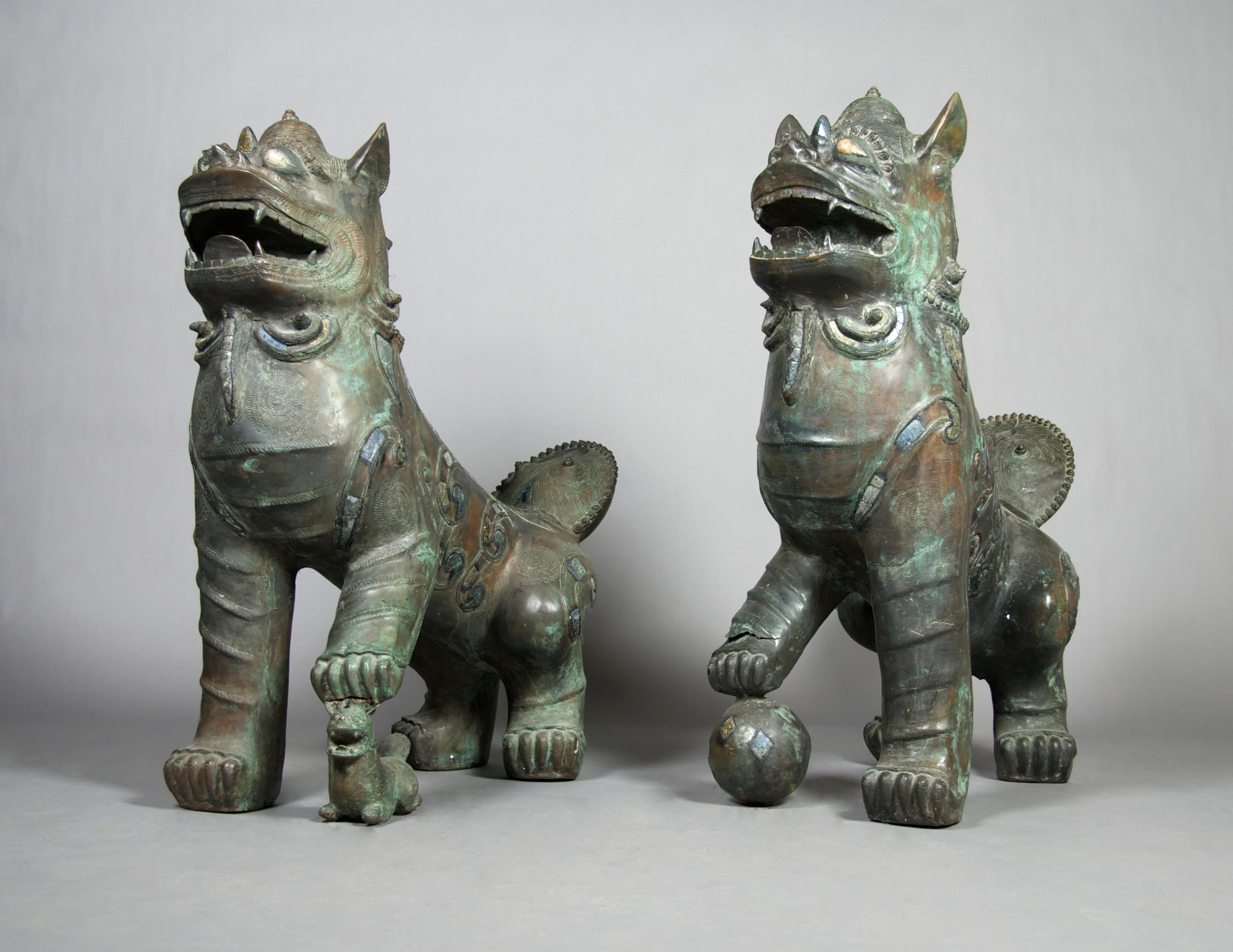 A Pair of Chinese Bronze Fu Dogs, Height 44 inches.