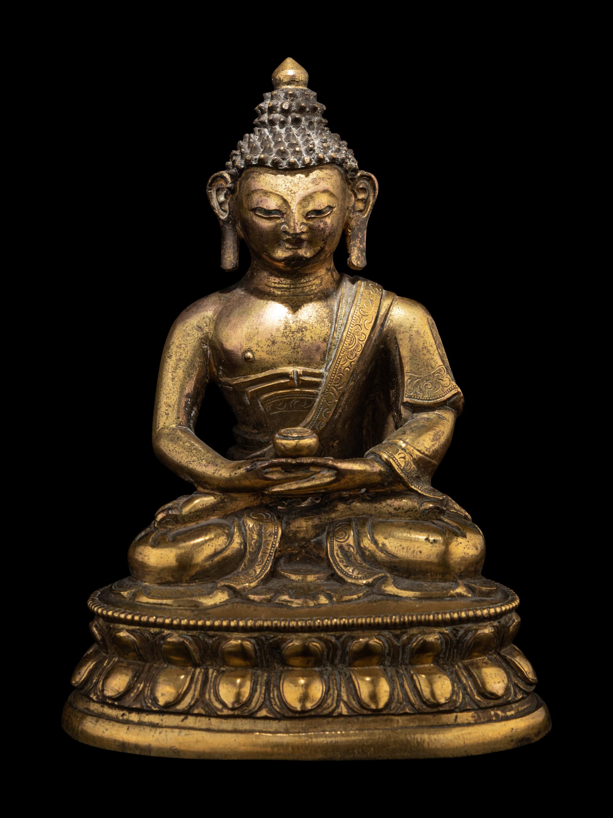 A Small Tibetan Gilt Bronze Figure of Medicine Buddha