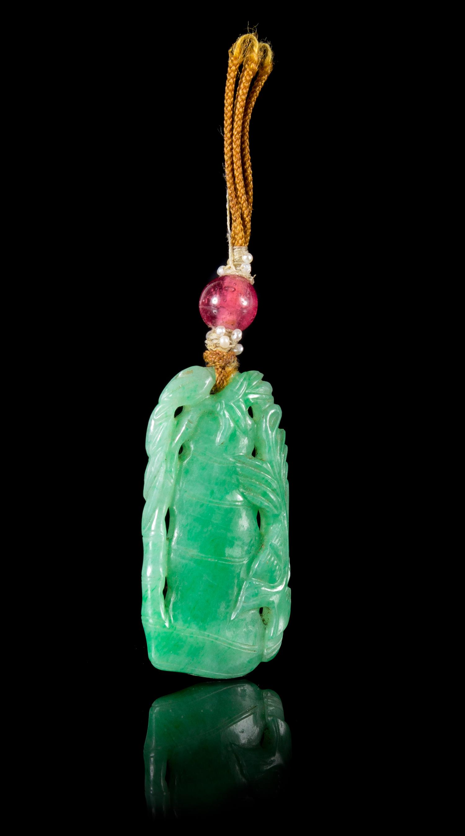 A Jadeite Pendant Length 1 5/8 x width 7/8 inches.