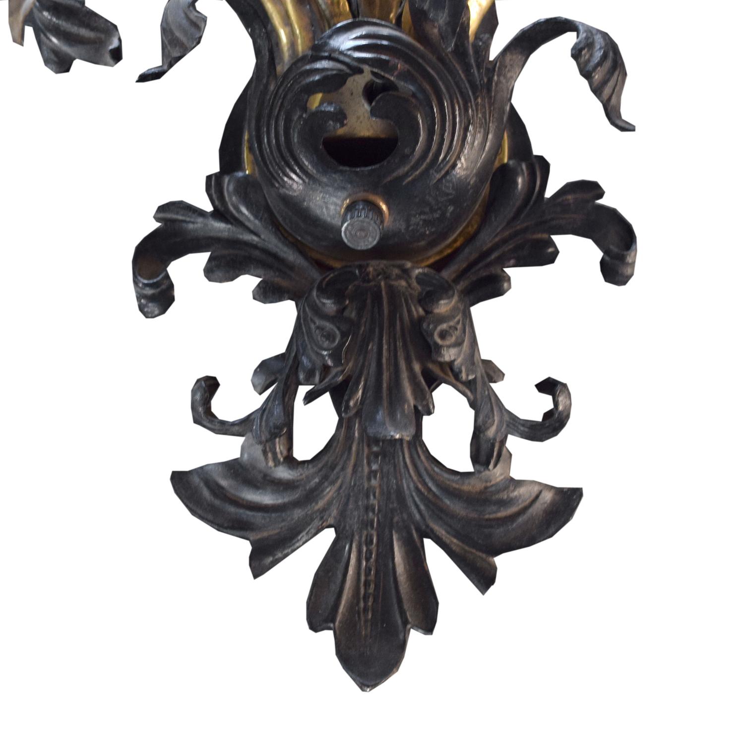 A Brass and Iron Seven Arm Wall Sconce, United States, Circa 1930,