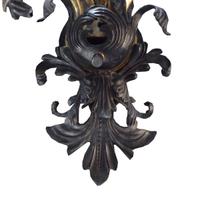A Brass and Iron Seven Arm Wall Sconce, United States, Circa 1930,
