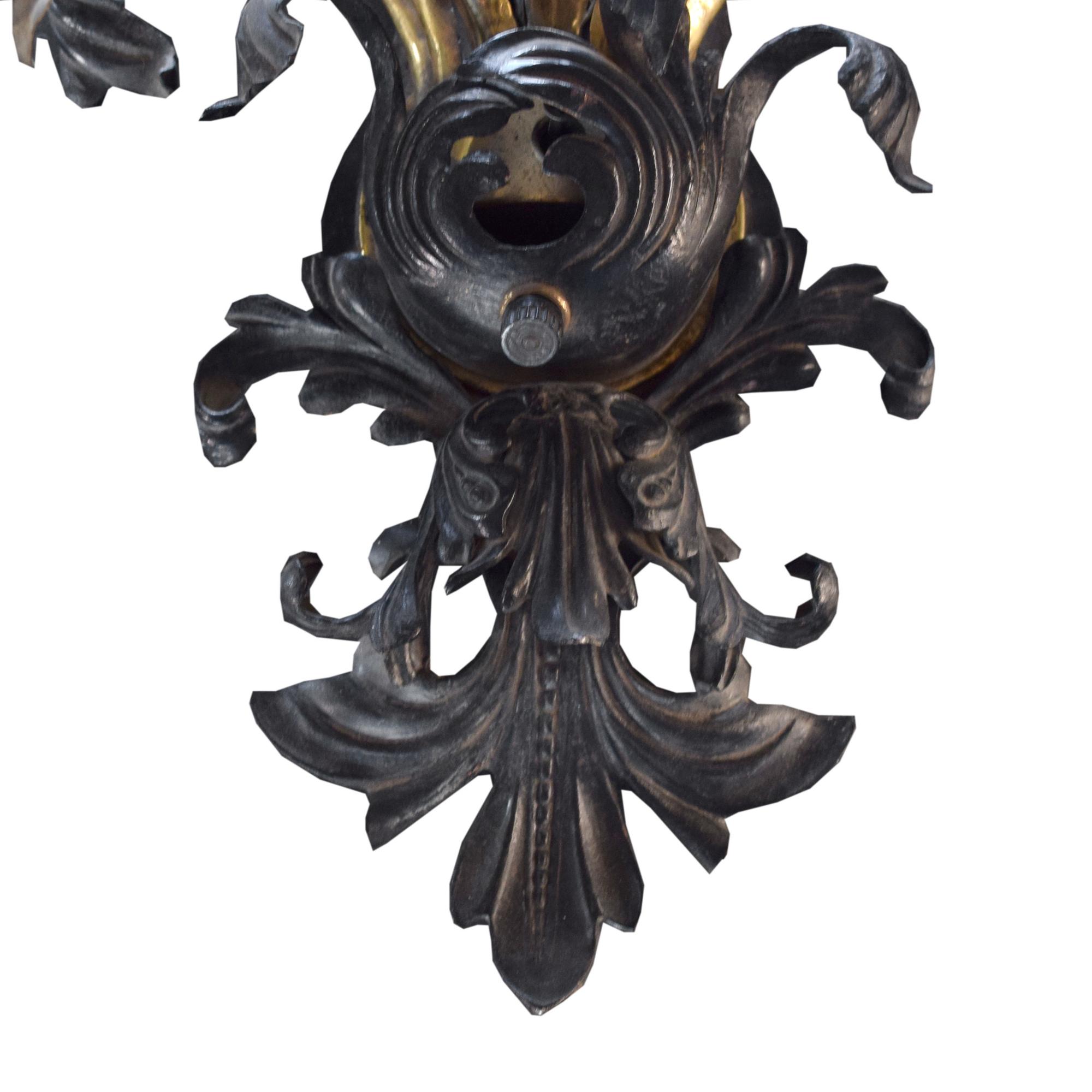 A Brass and Iron Seven Arm Wall Sconce, United States, Circa 1930,