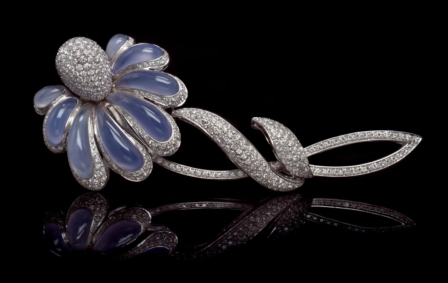 An 18 Karat White Gold, Chalcedony and Diamond Flower Brooch, 28.40 dwts.