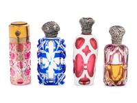 A Collection of Silver Mounted Glass Jars and Perfume Bottles