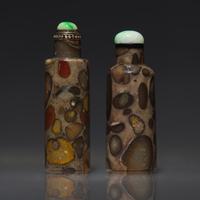 Two Chinese Cylindrical Puddingstone Snuff Bottles, Qing Dynasty, Circa 1760-1860 — 1760-1860年 抱子石素面鼻煙壺兩支
