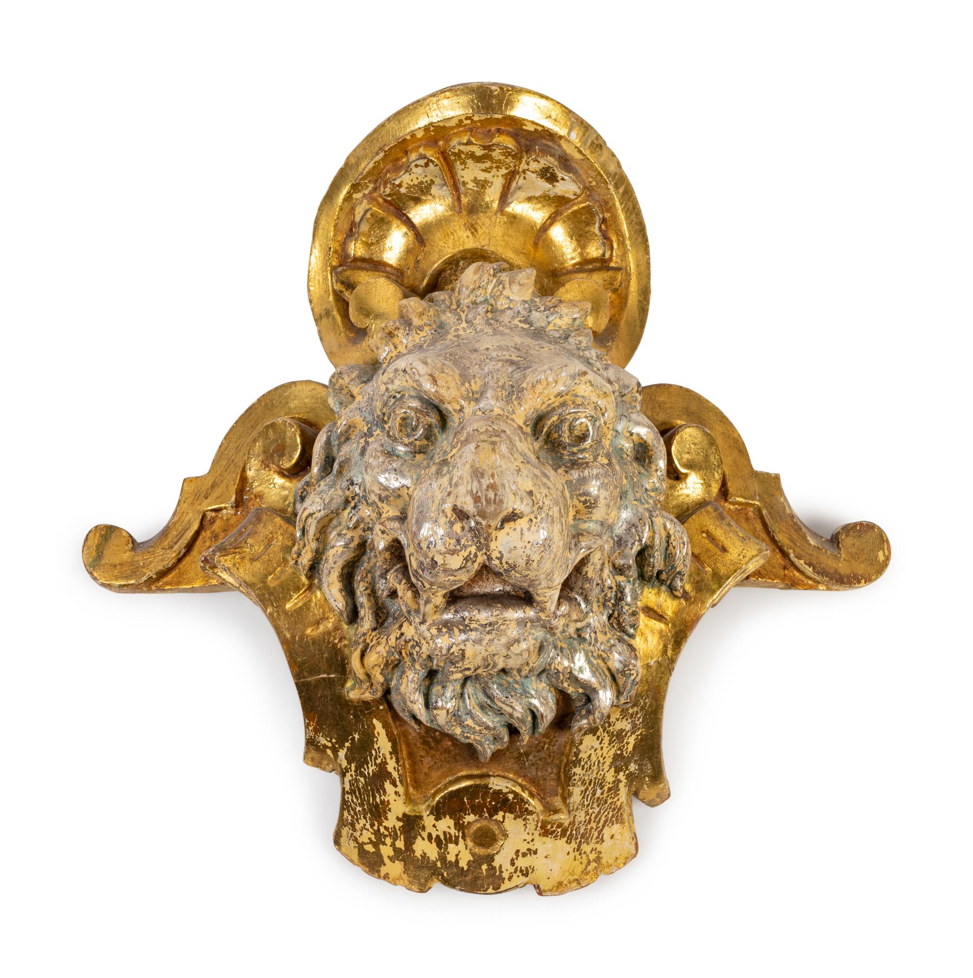 A Pair of English Part Silvered Giltwood Lion Masks — SECOND QUARTER 19TH CENTURY