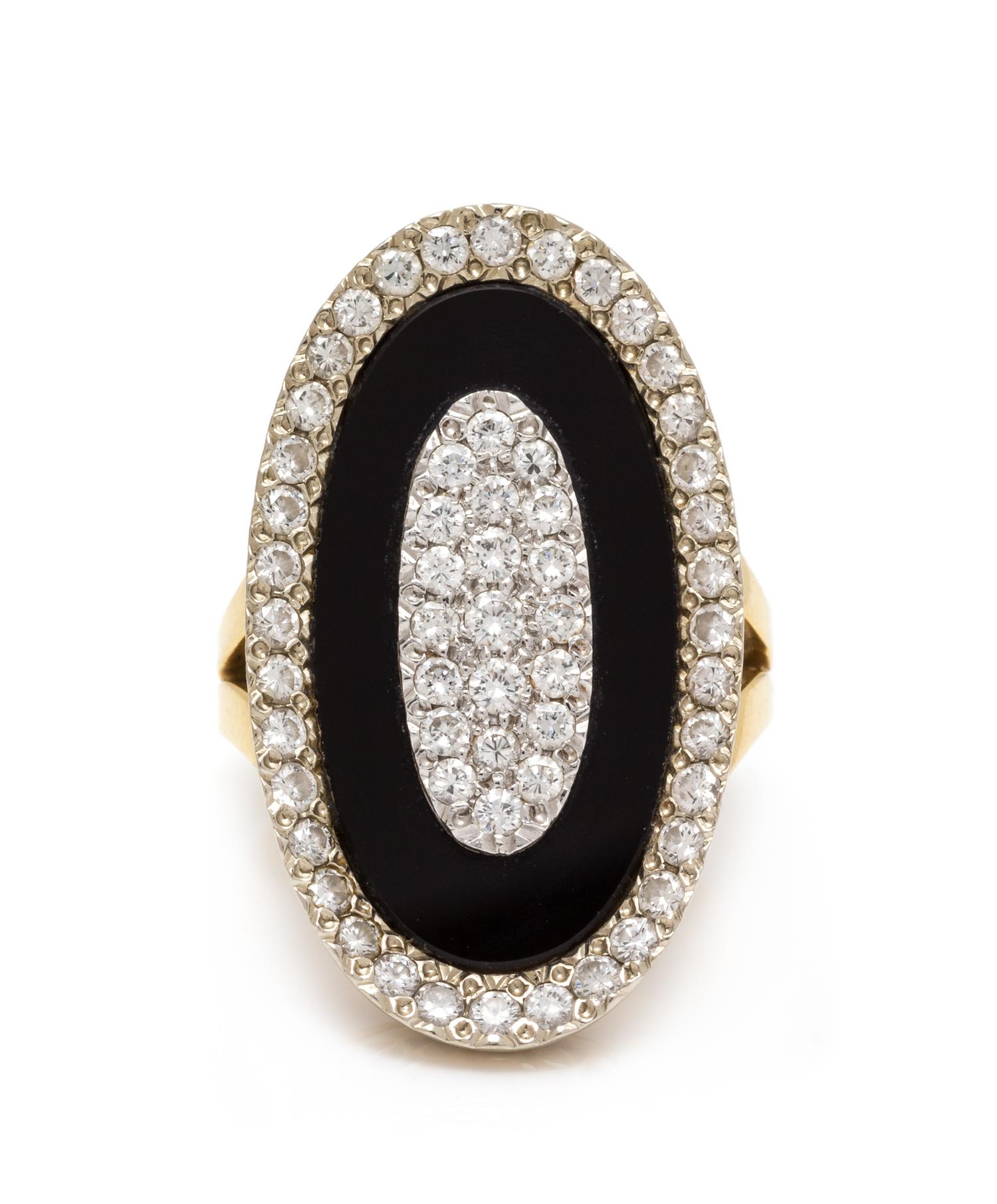 An 18 Karat Bicolor Gold, Diamond and Onyx Ring, 8.75 dwts.
