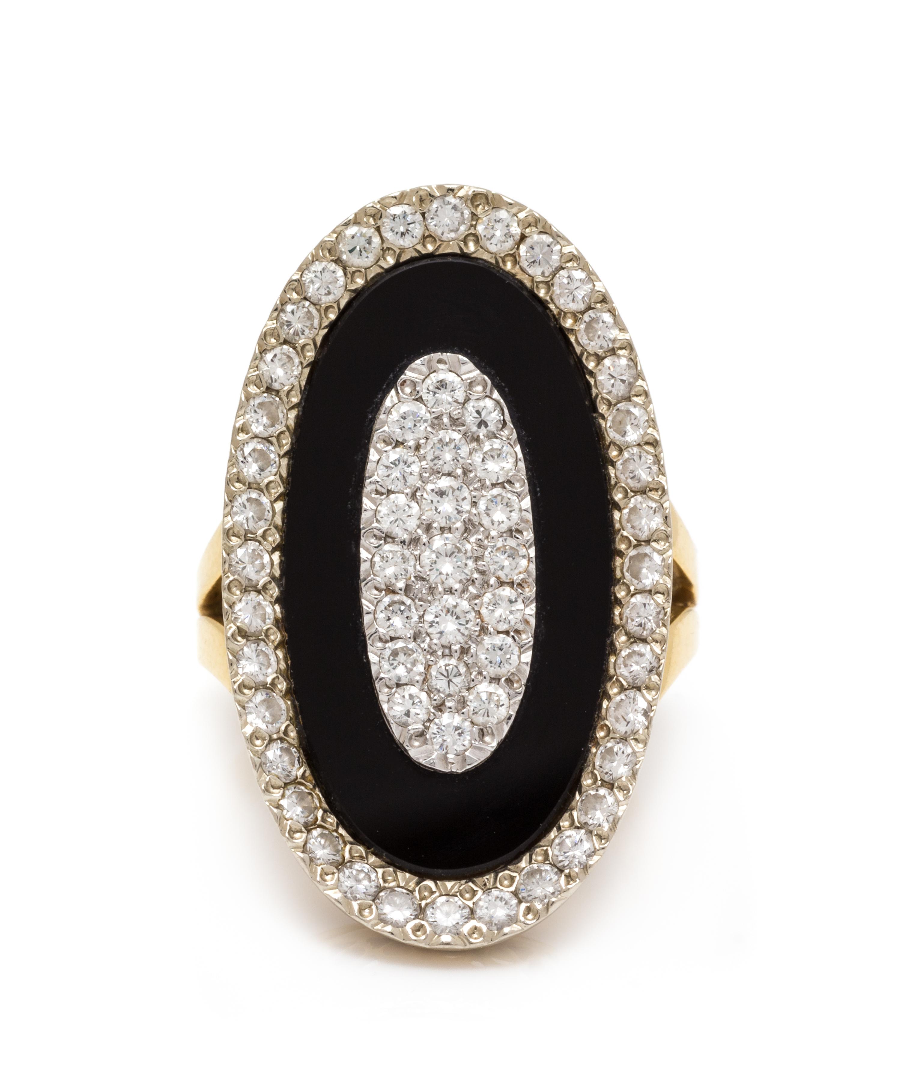 An 18 Karat Bicolor Gold, Diamond and Onyx Ring, 8.75 dwts.