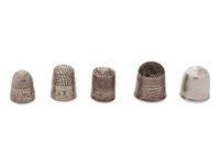 A Group of Five Silver Children's Thimbles