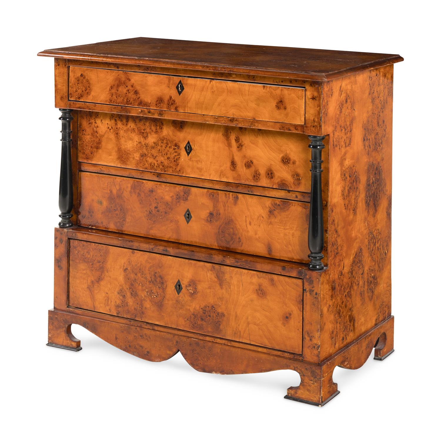 A Biedermeier Part-Ebonized Burlwood Commode