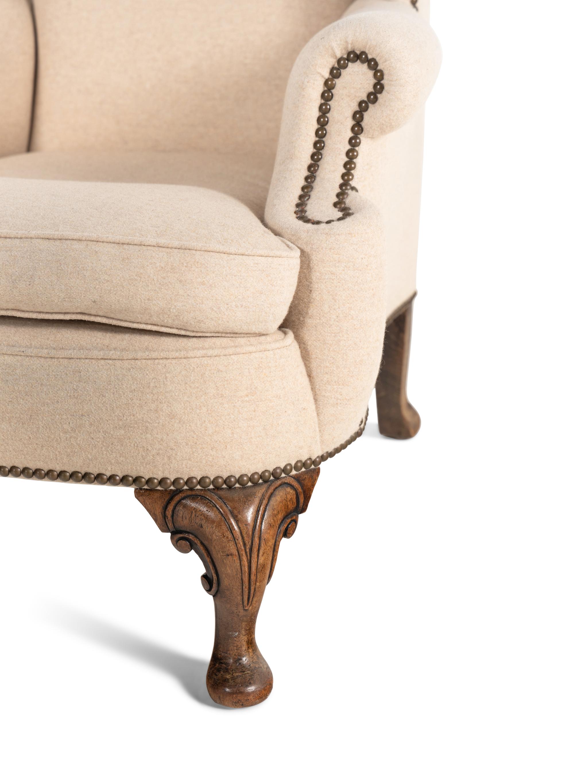 A Pair of Queen Anne Style Wingback Armchairs