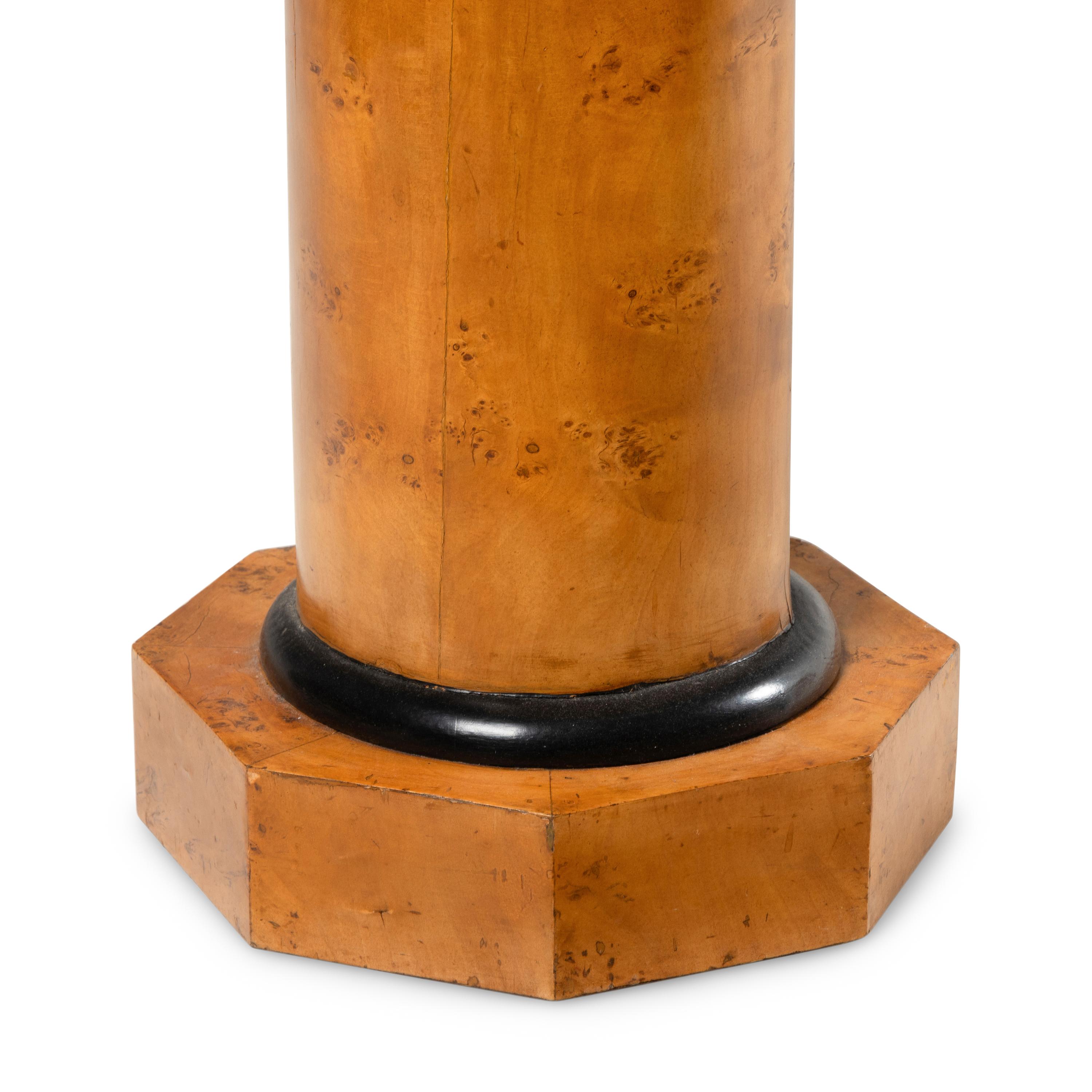 A Biedermeier Karelian Birch and Ebonized Pedestal