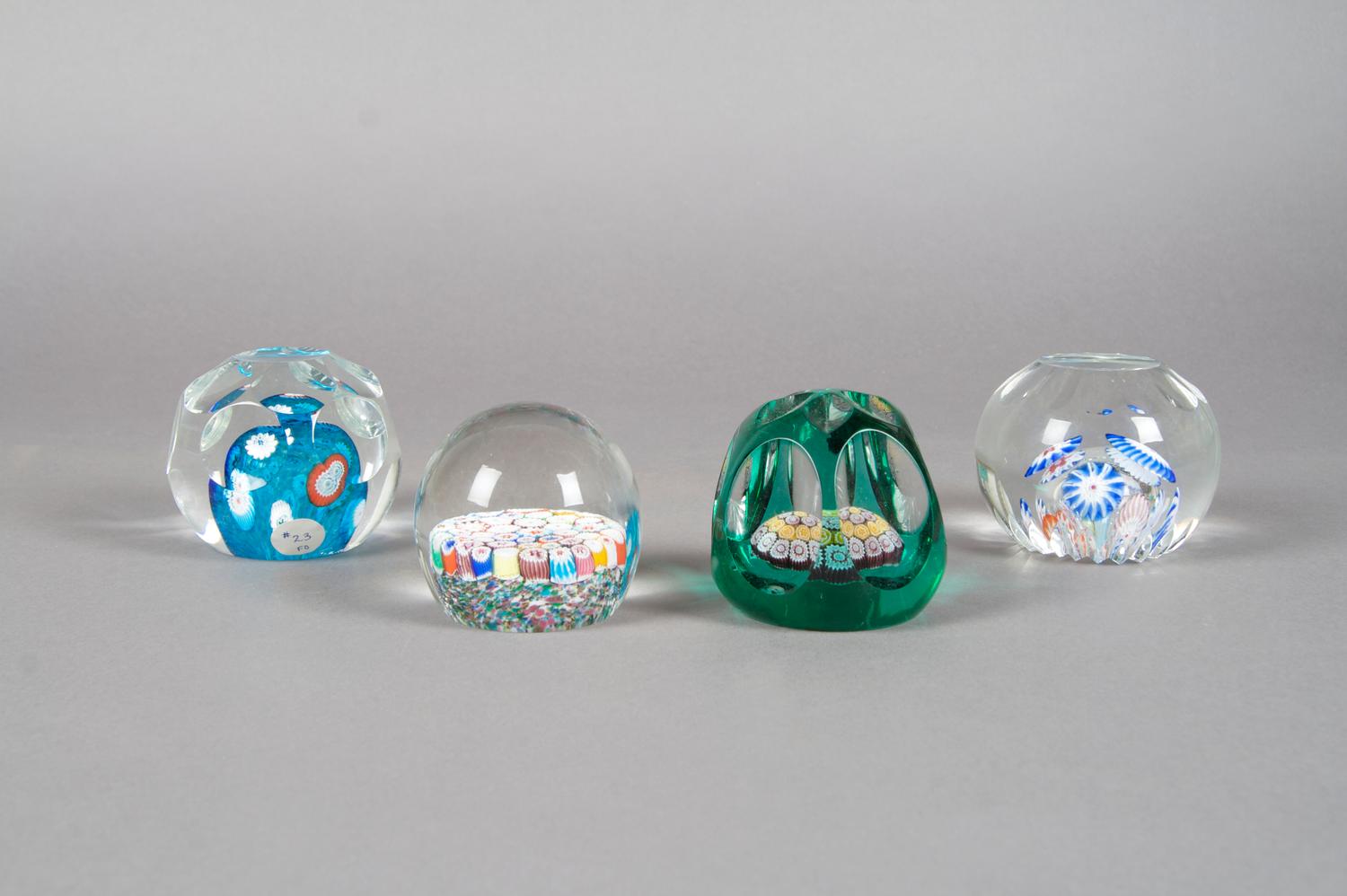 A Collection of Four Paperweights, Diameter of largest 3 1/2 inches.