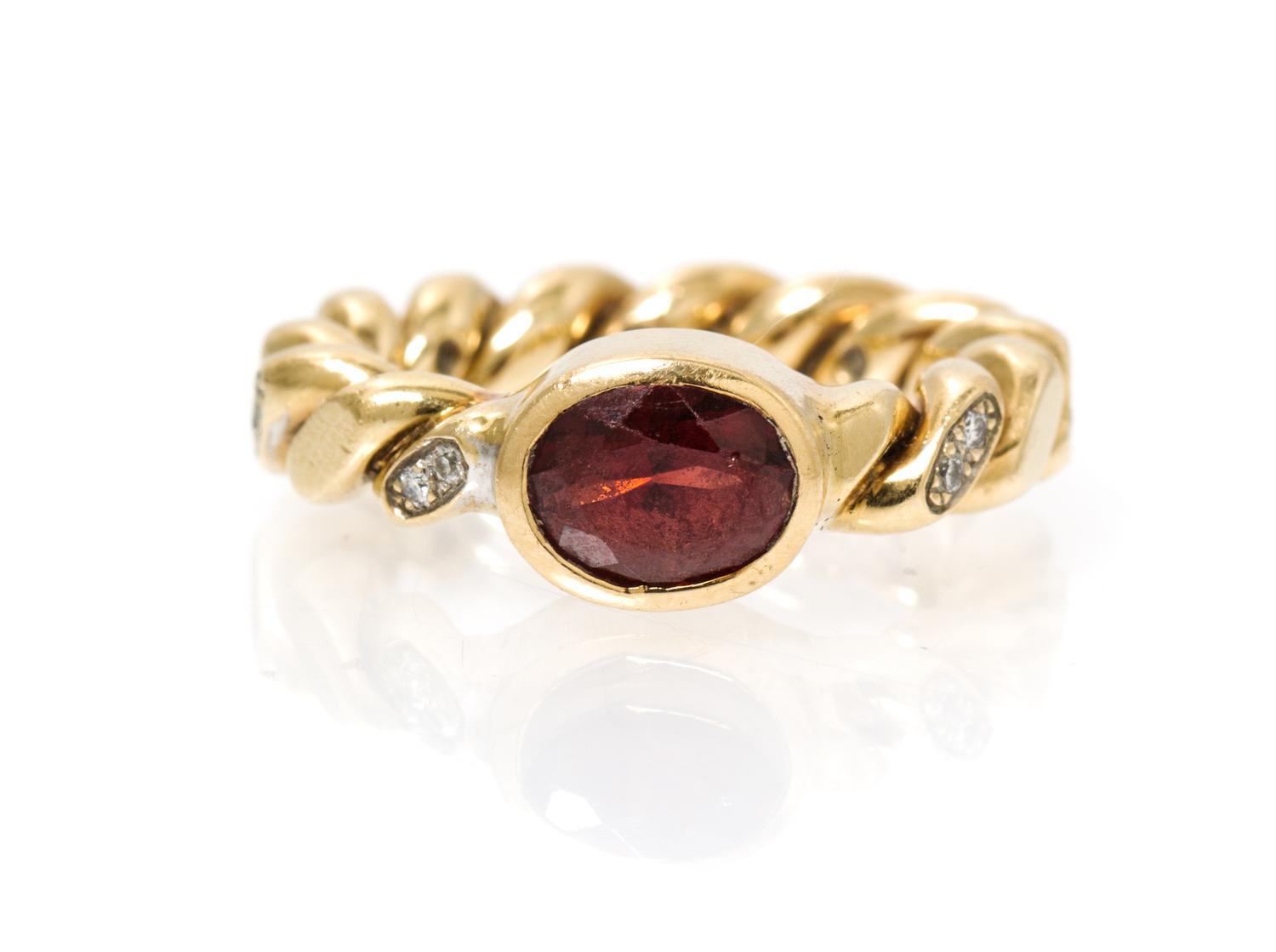 A 14 Karat Yellow Gold, Garnet and Diamond Ring, M&J Savitt, 6.00 dwts.
