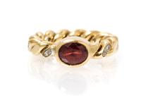 A 14 Karat Yellow Gold, Garnet and Diamond Ring, M&J Savitt, 6.00 dwts.