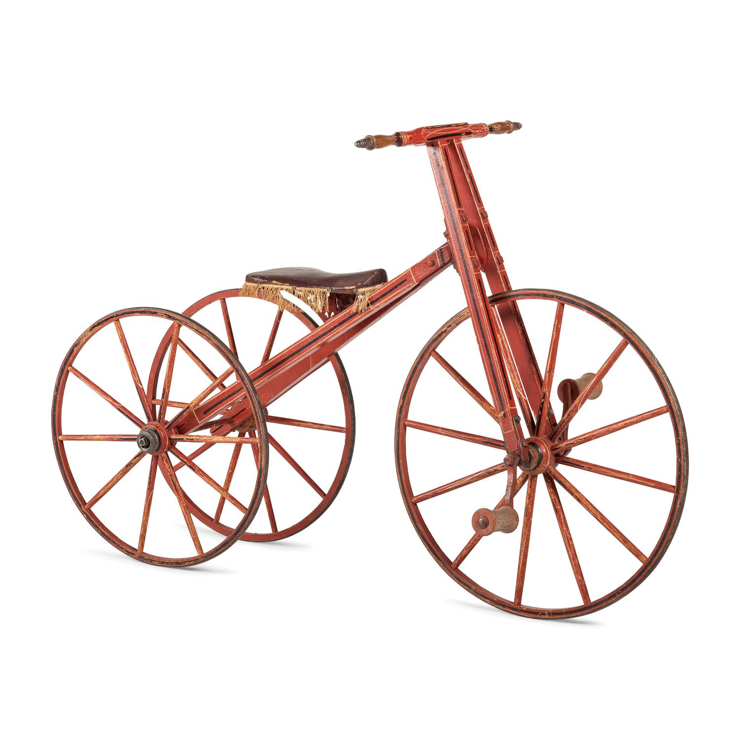 A Carved and Painted Wood Boneshaker Child’s Bicycle