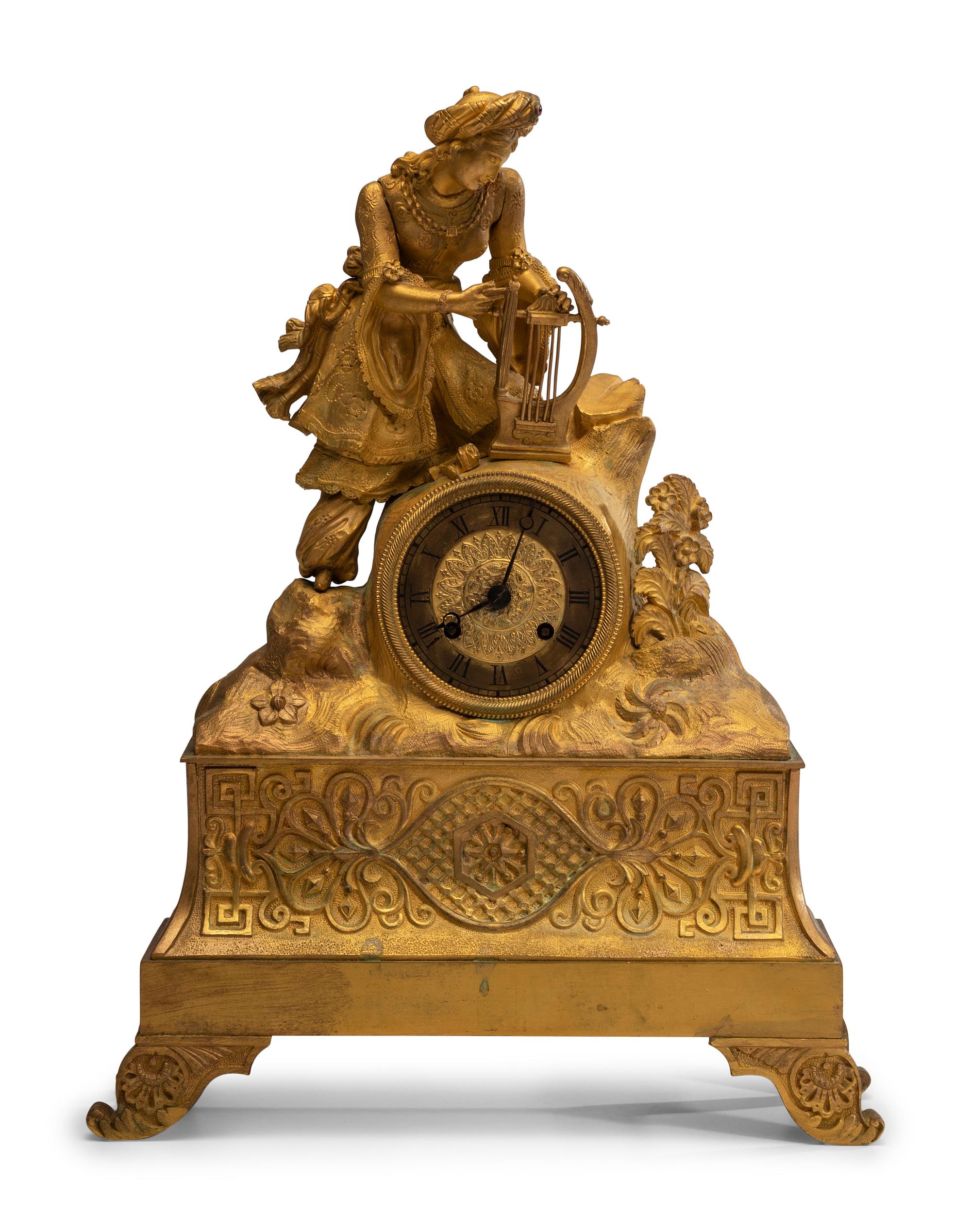 A Continental Gilt Metal Figural Mantel Clock