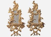 A pair of George III Rococo style giltwood mirrors, 20th century