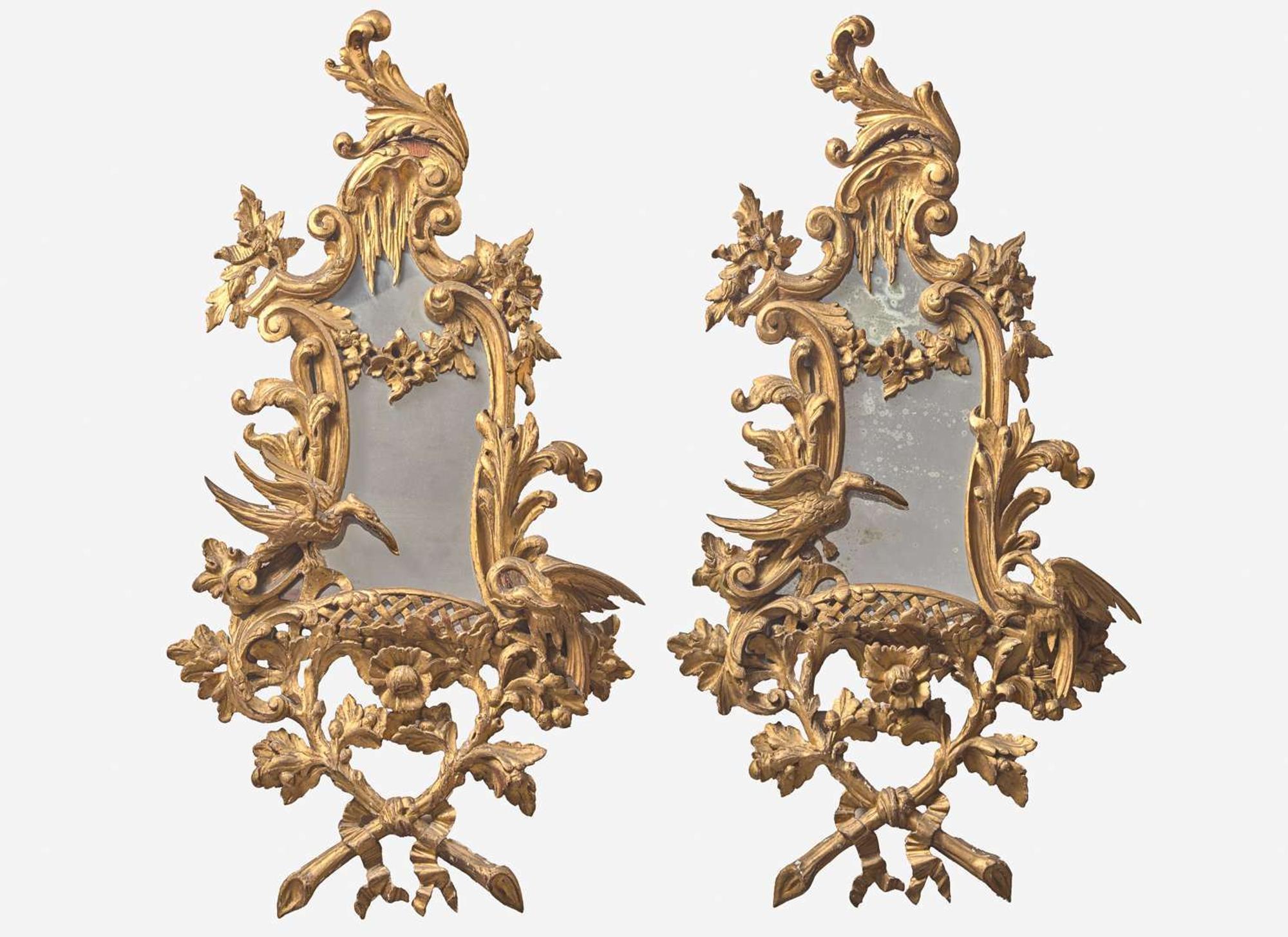 A pair of George III Rococo style giltwood mirrors, 20th century