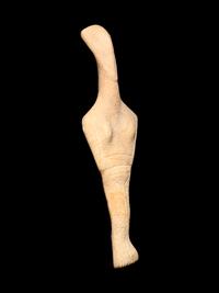 A Cycladic Marble Reclining Female Figure