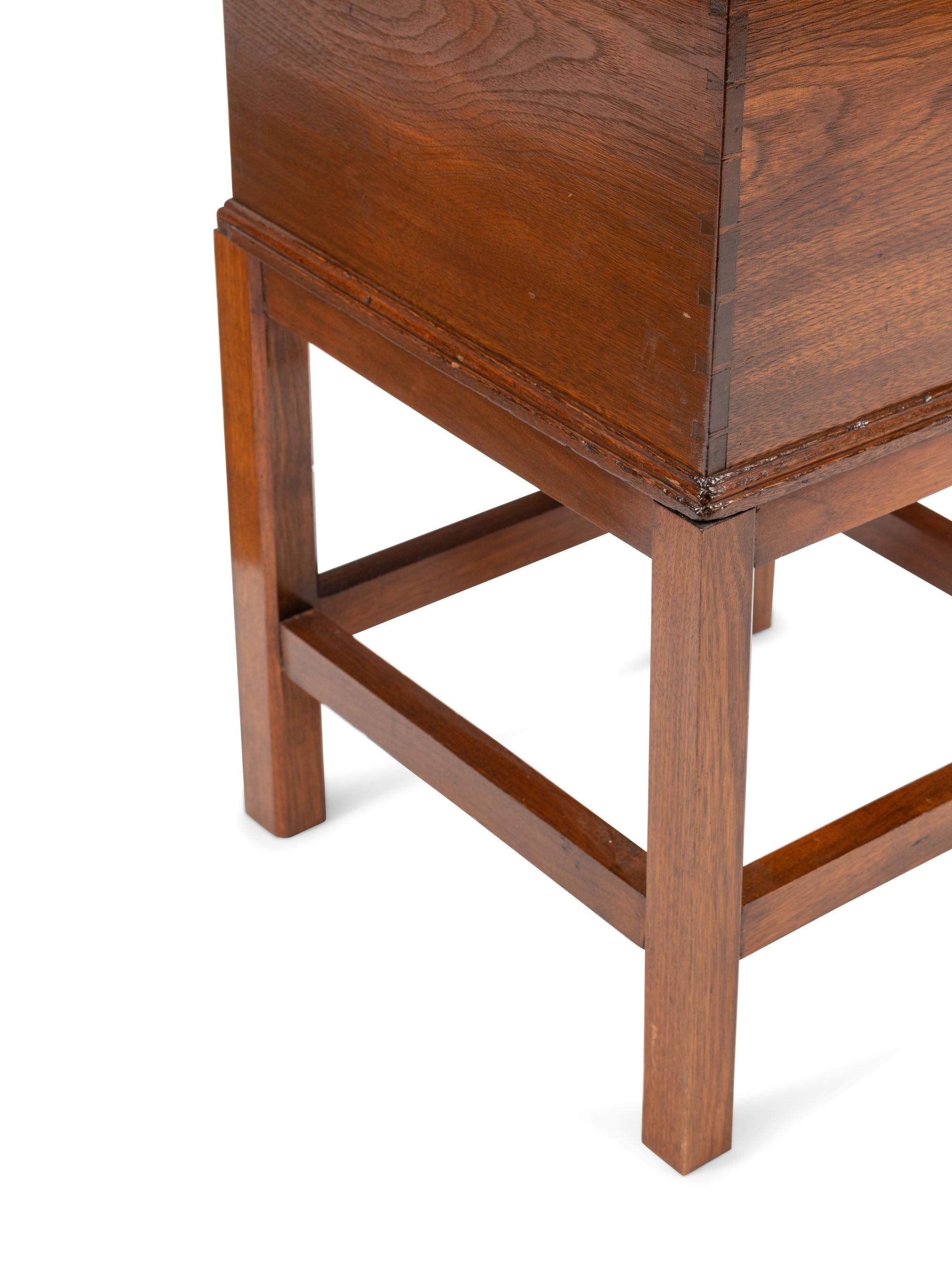 An English Mahogany Cellarette on a Later Stand
