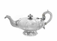 An Irish William IV Silver Teapot, James Fray, Dublin, 1832, of squat form, the lobed body worked with an engraved armorial crest.