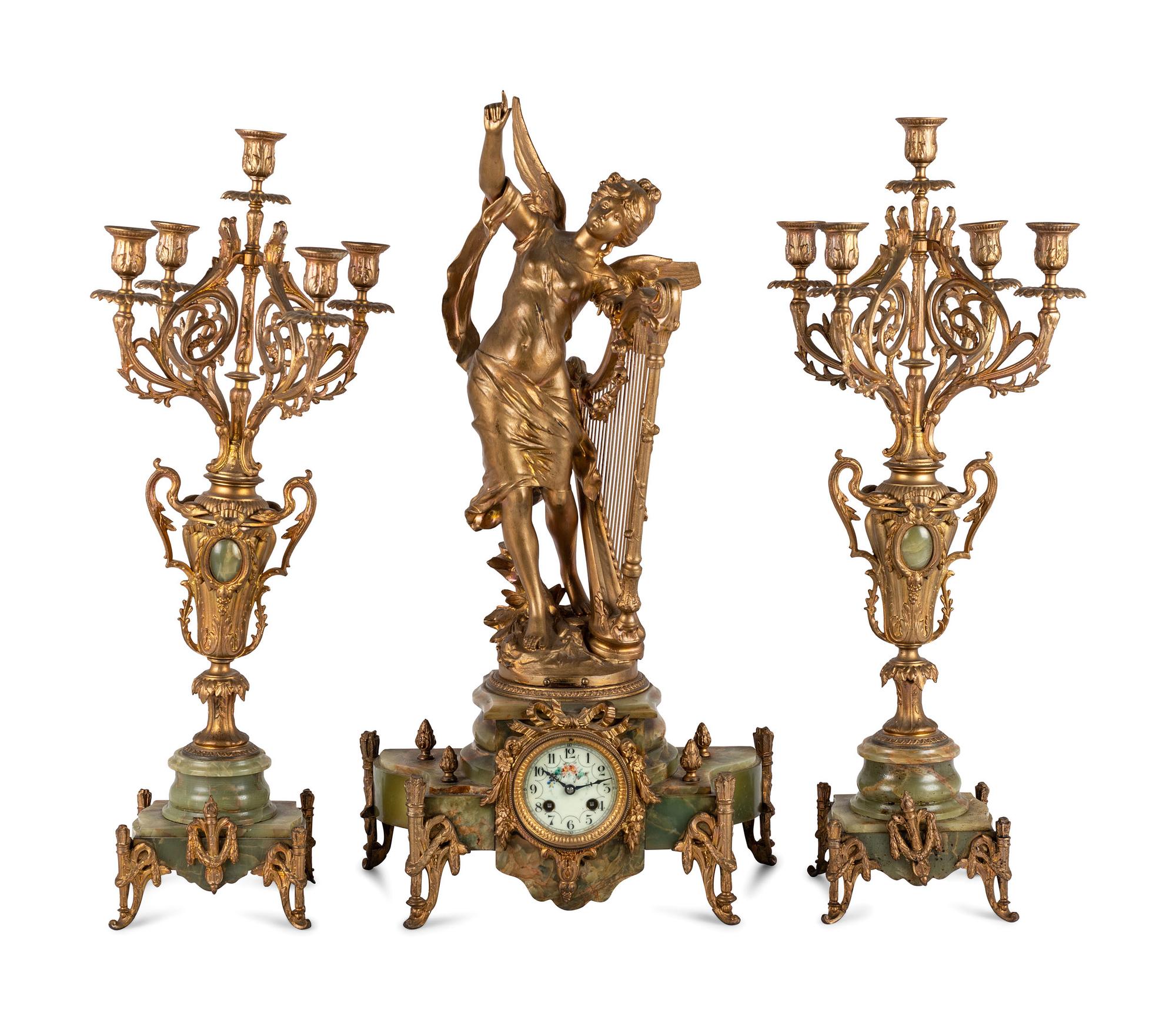 A Neoclassical Gilt Metal and Onyx Clock Garniture