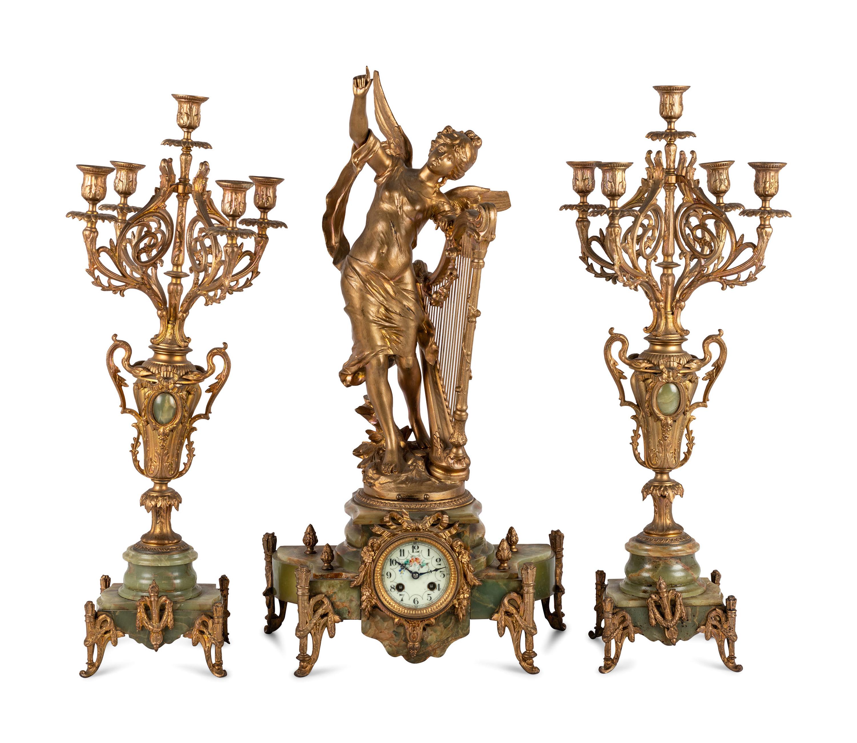 A Neoclassical Gilt Metal and Onyx Clock Garniture