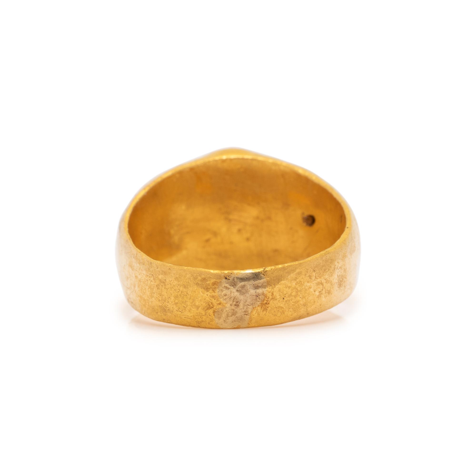 A Roman Gold and Red Jasper Finger Ring with a Male Portrait Head
