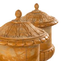 A Pair of Continental Carved Marble Covered Urns