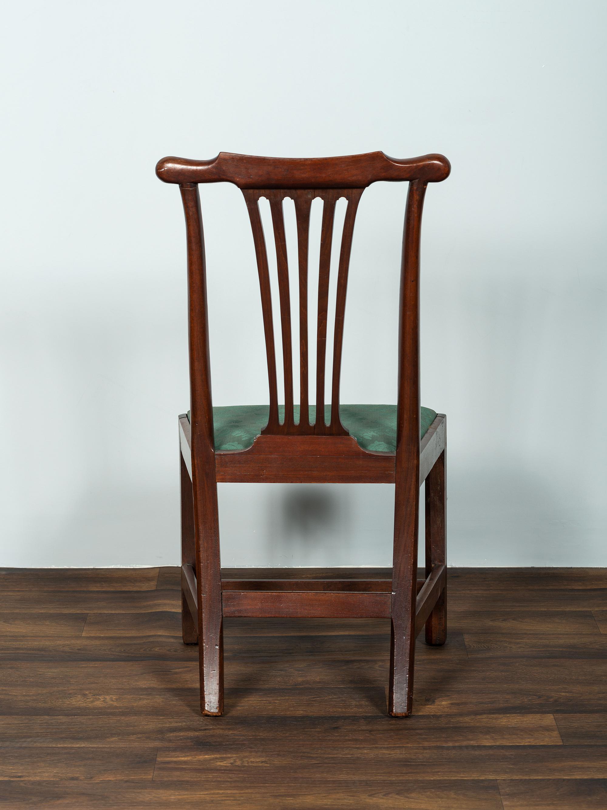 A Set of Six Chippendale Volute-Carved Mahogany Side Chairs