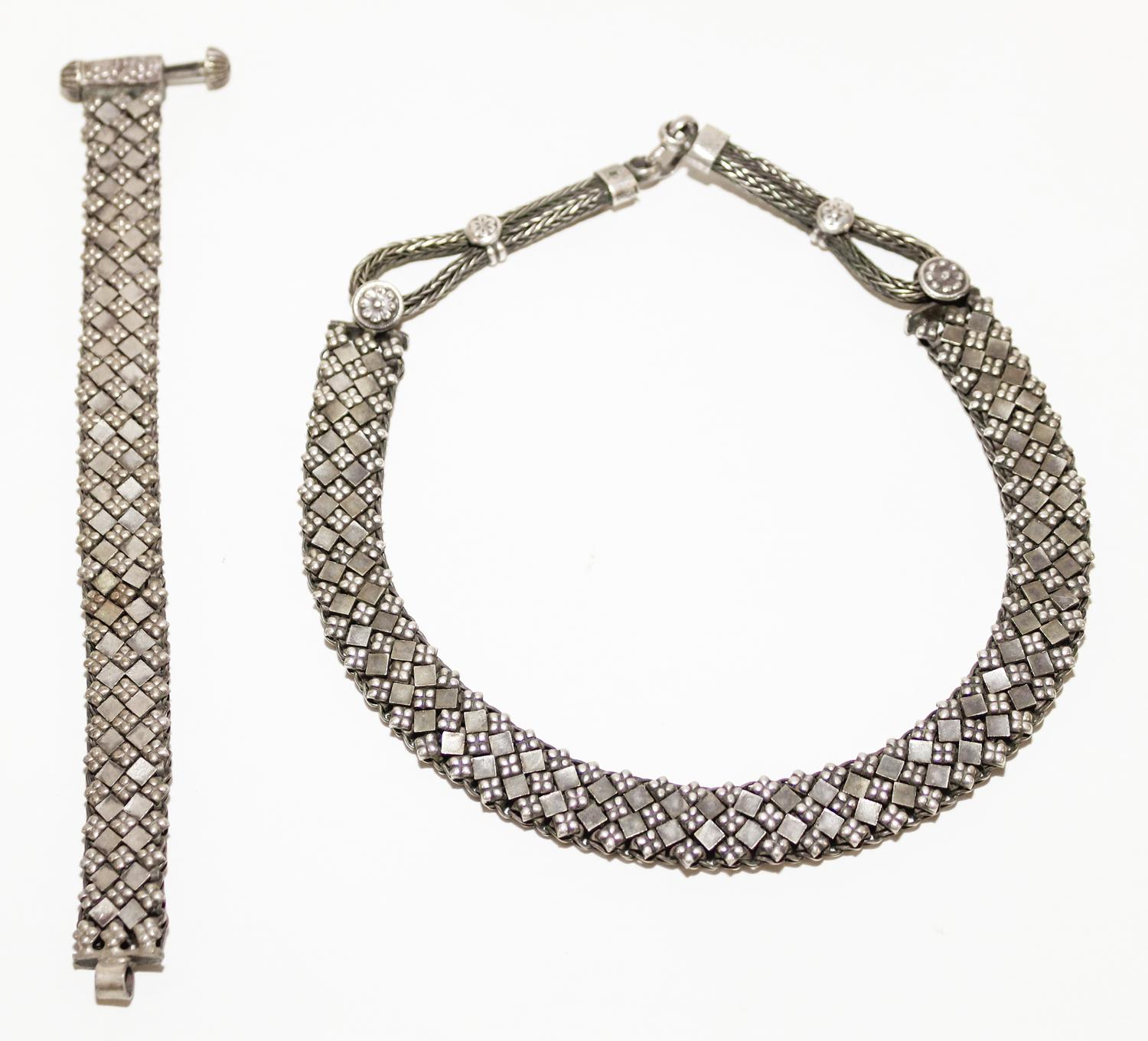 A Silver Necklace and Bracelet Length of chain 9 1/2 inches.