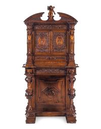 A Renaissance Revival Carved Walnut Cabinet on Stand