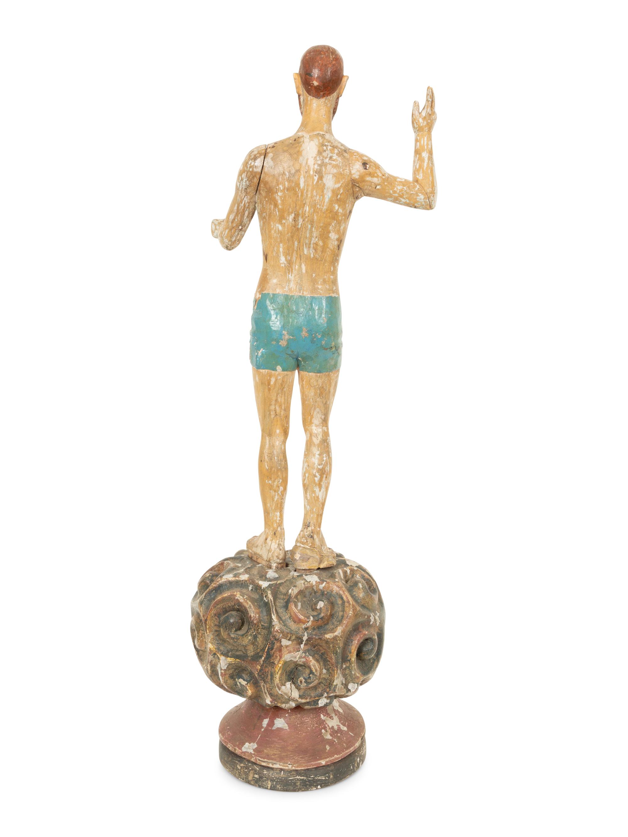An Italian Carved and Polychromed Giltwood Santos Figure