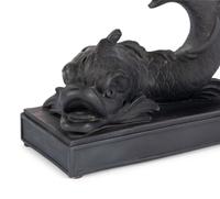 A Pair of Wedgwood Basalt Dolphin Candlesticks