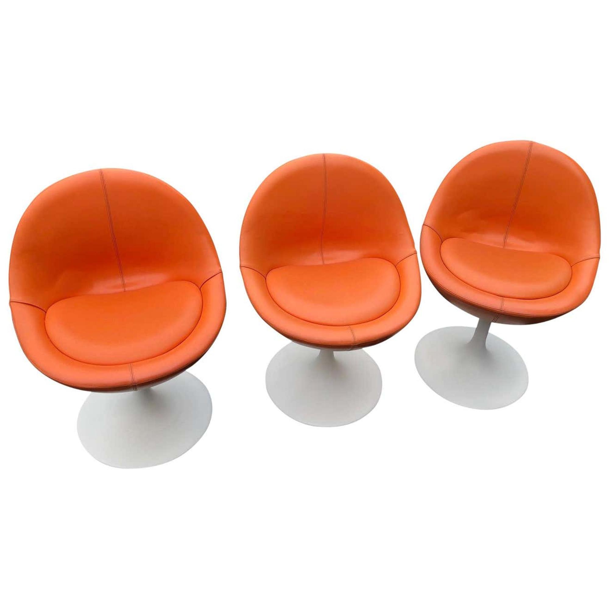 A Set of Three Modern Tulip-Form Leather Upholstered Stools