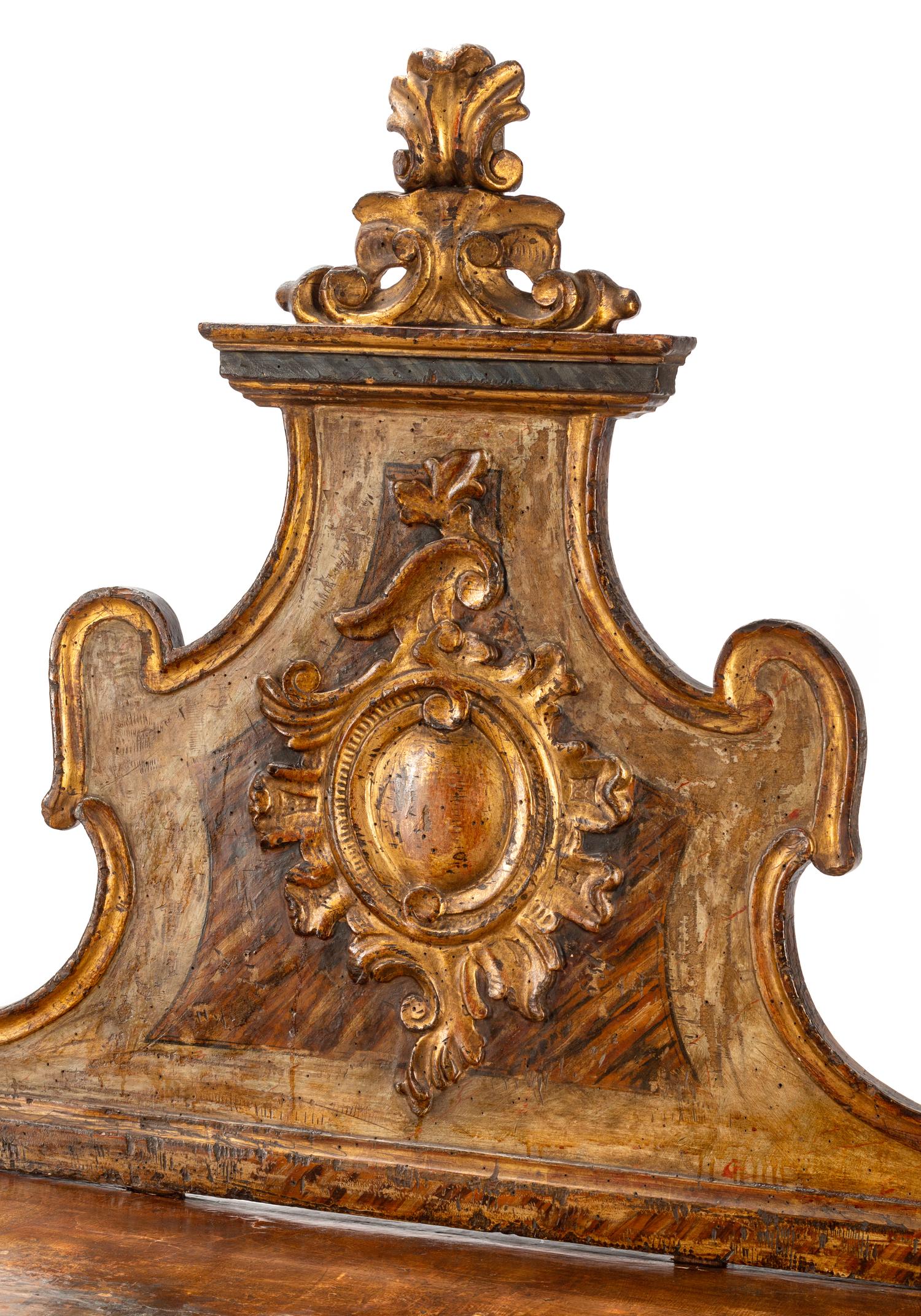 A Pair of Venetian Painted and Parcel Gilt Console Tables