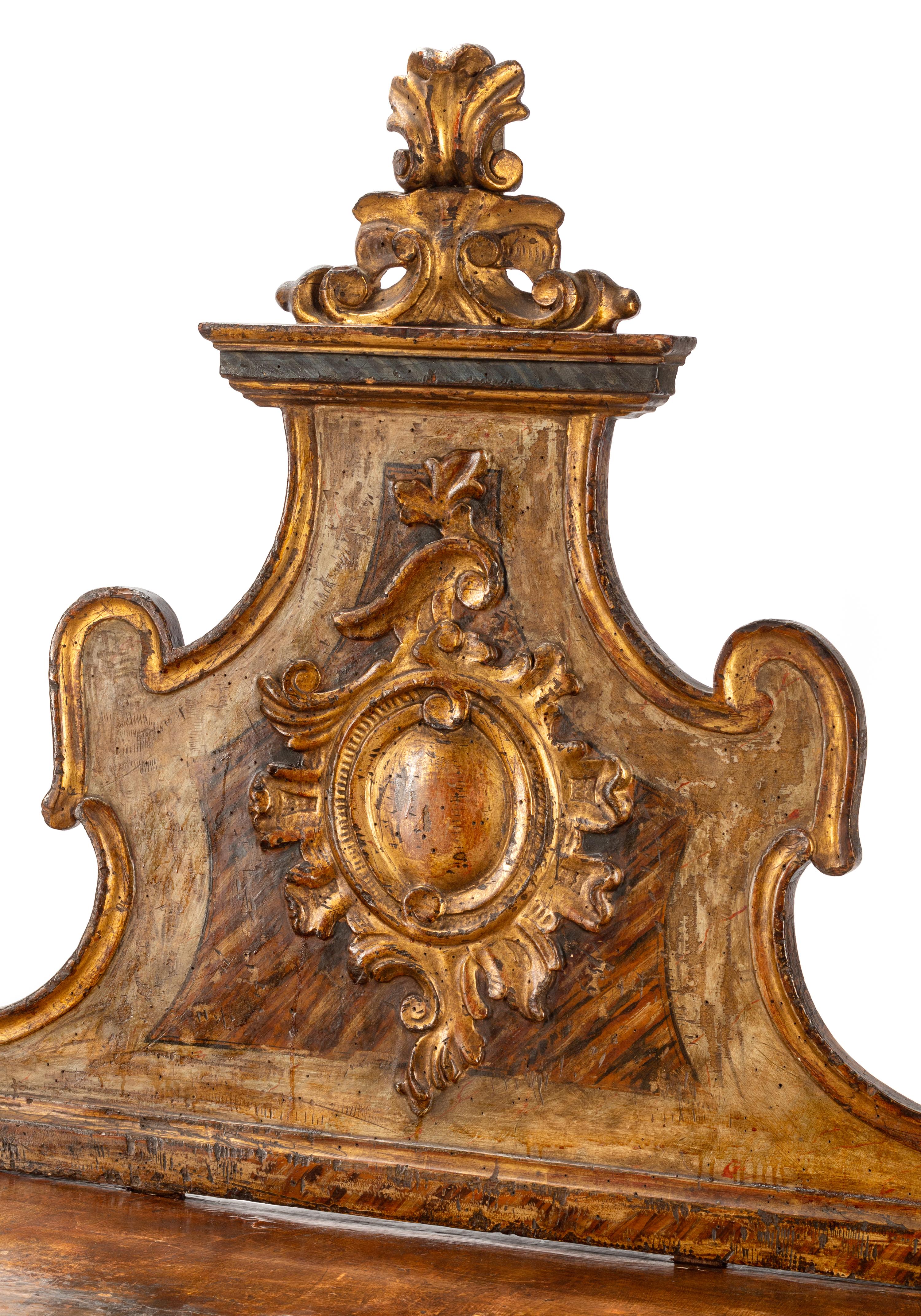 A Pair of Venetian Painted and Parcel Gilt Console Tables