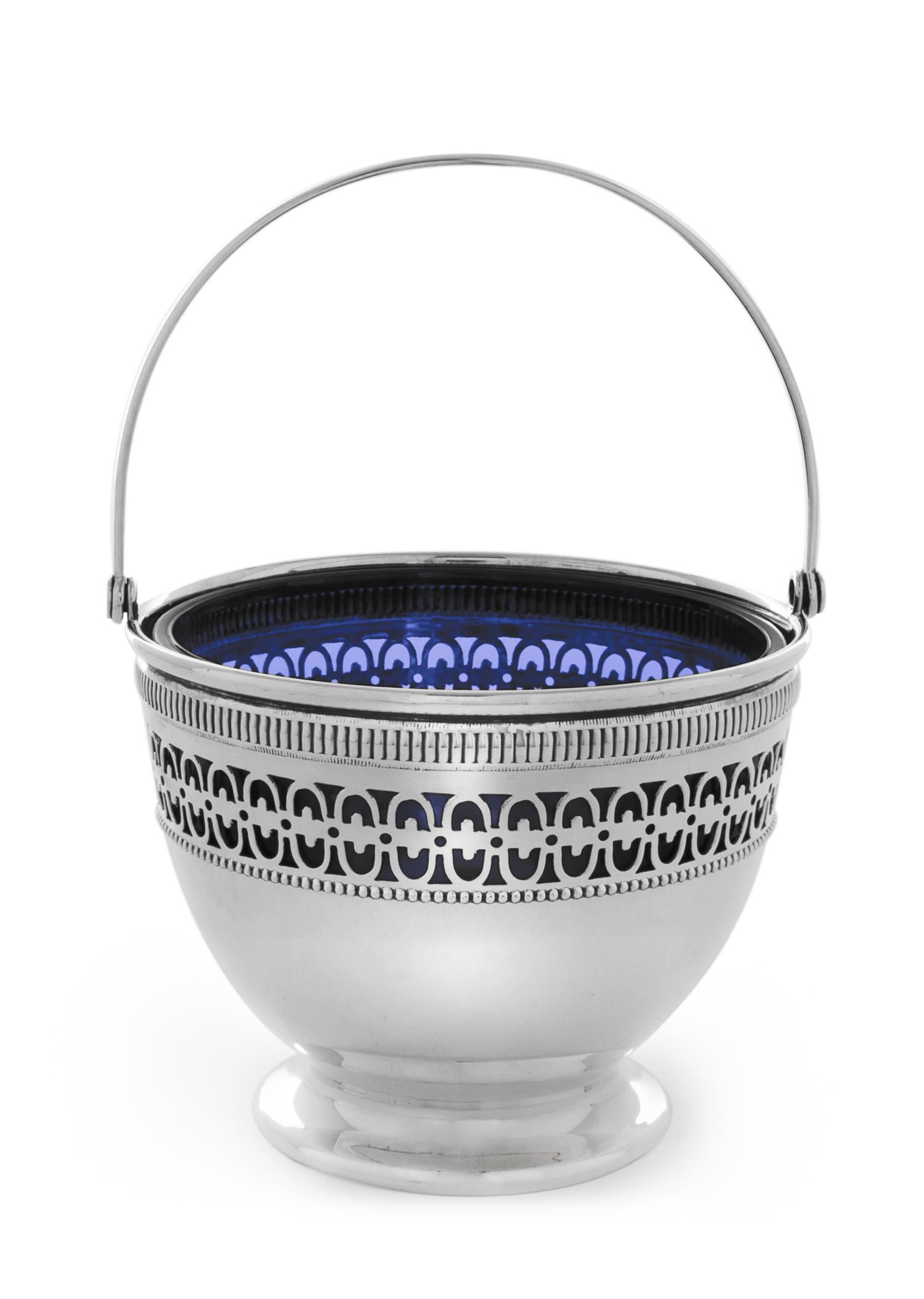 An American Silver Nut Dish, Webster Co., North Attleboro, MA, having a swinging handle surmounting a pierce decorated body with a blue