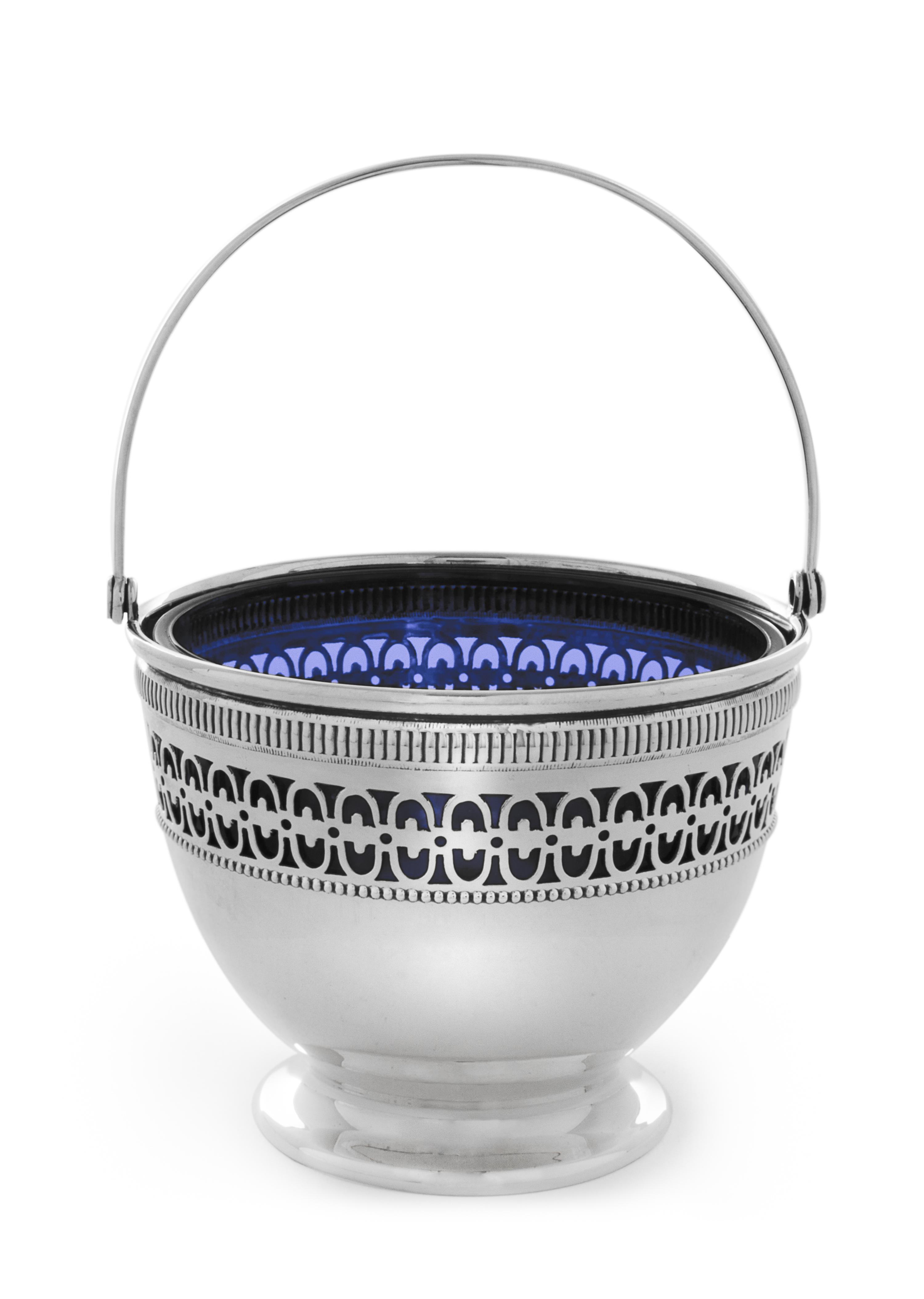 An American Silver Nut Dish, Webster Co., North Attleboro, MA, having a swinging handle surmounting a pierce decorated body with a blue