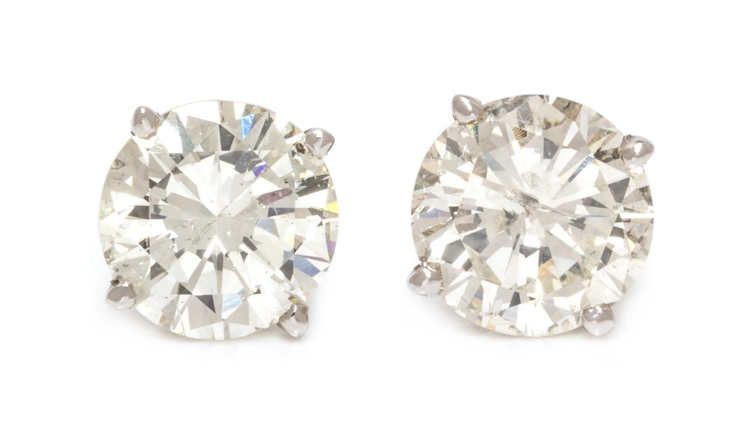 A Pair of 18 Karat White Gold and Diamond Stud Earrings, 1.40 dwts.