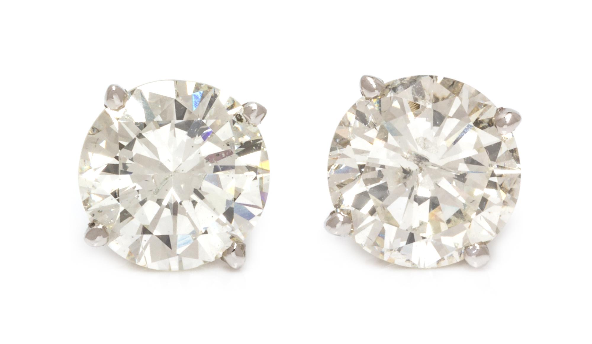 A Pair of 18 Karat White Gold and Diamond Stud Earrings, 1.40 dwts.