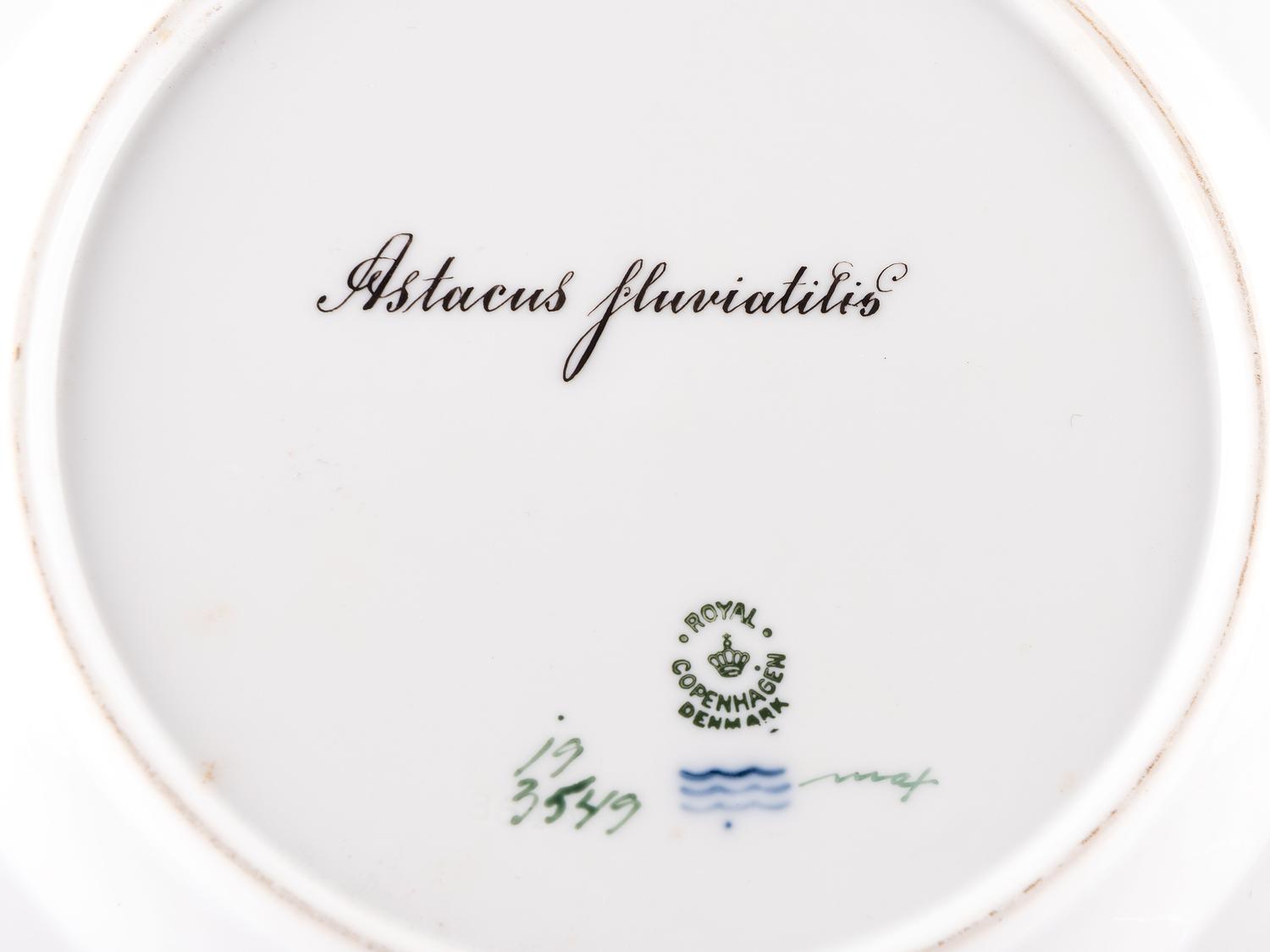 A Set of Twelve Royal Copenhagen Parcel Gilt Porcelain Fish Plates