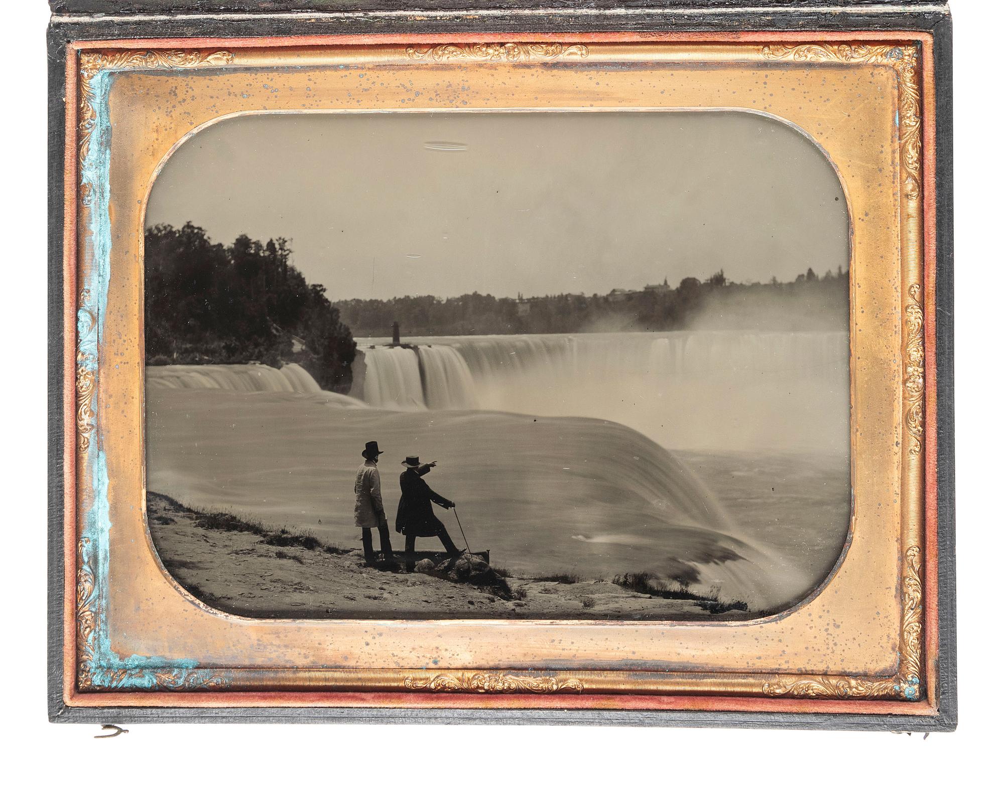 [EARLY PHOTOGRAPHY]. [BABBIT, Platt D. (1823-1879), attributed]. Whole plate ambrotype featuring two men surveying Niagara Falls from Prospect Point. Ca 1850s.