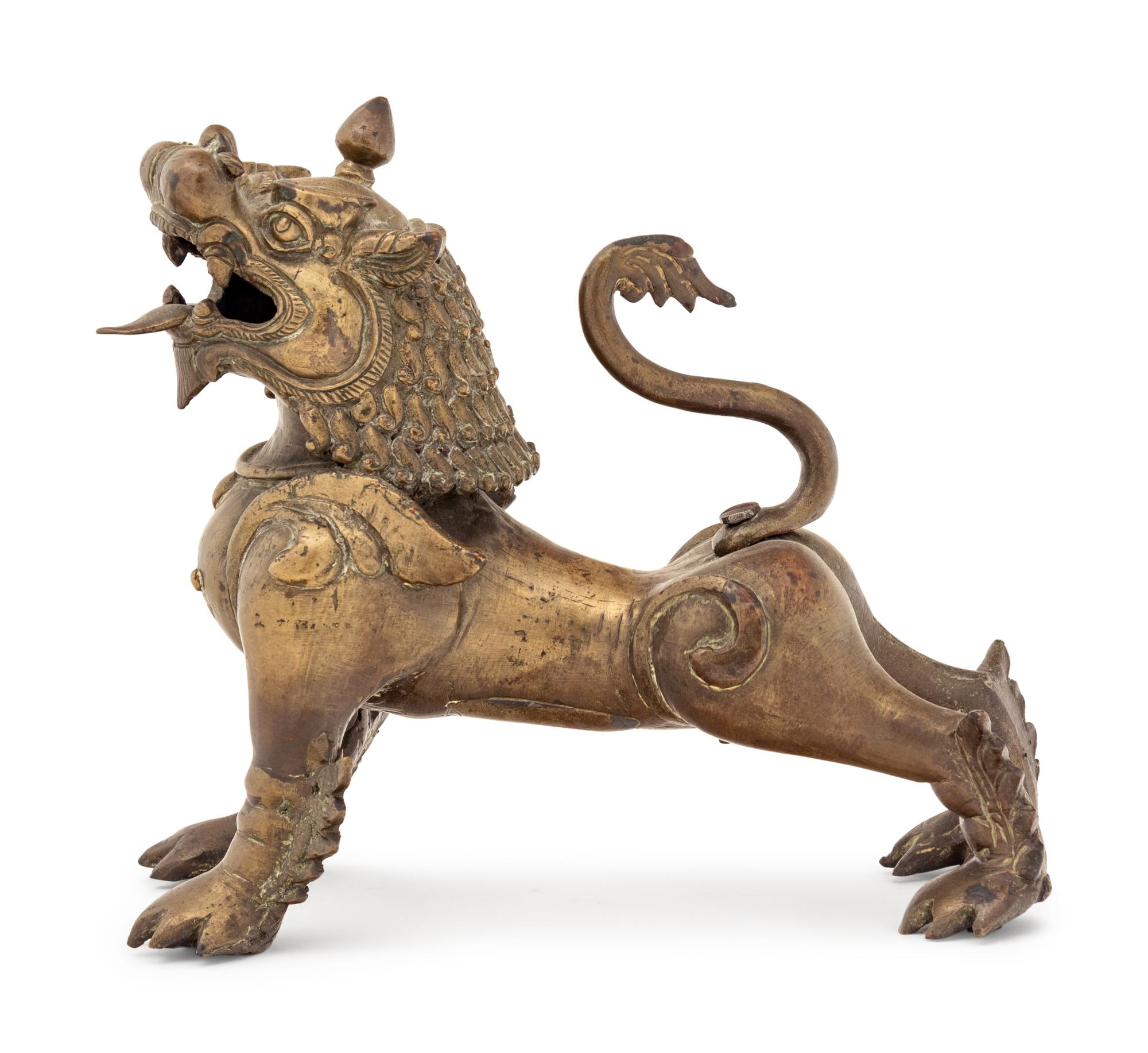 An Indian or Southeast Asian Brass Temple Lion