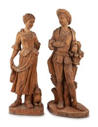 A Pair of Continental Carved Pine Figures