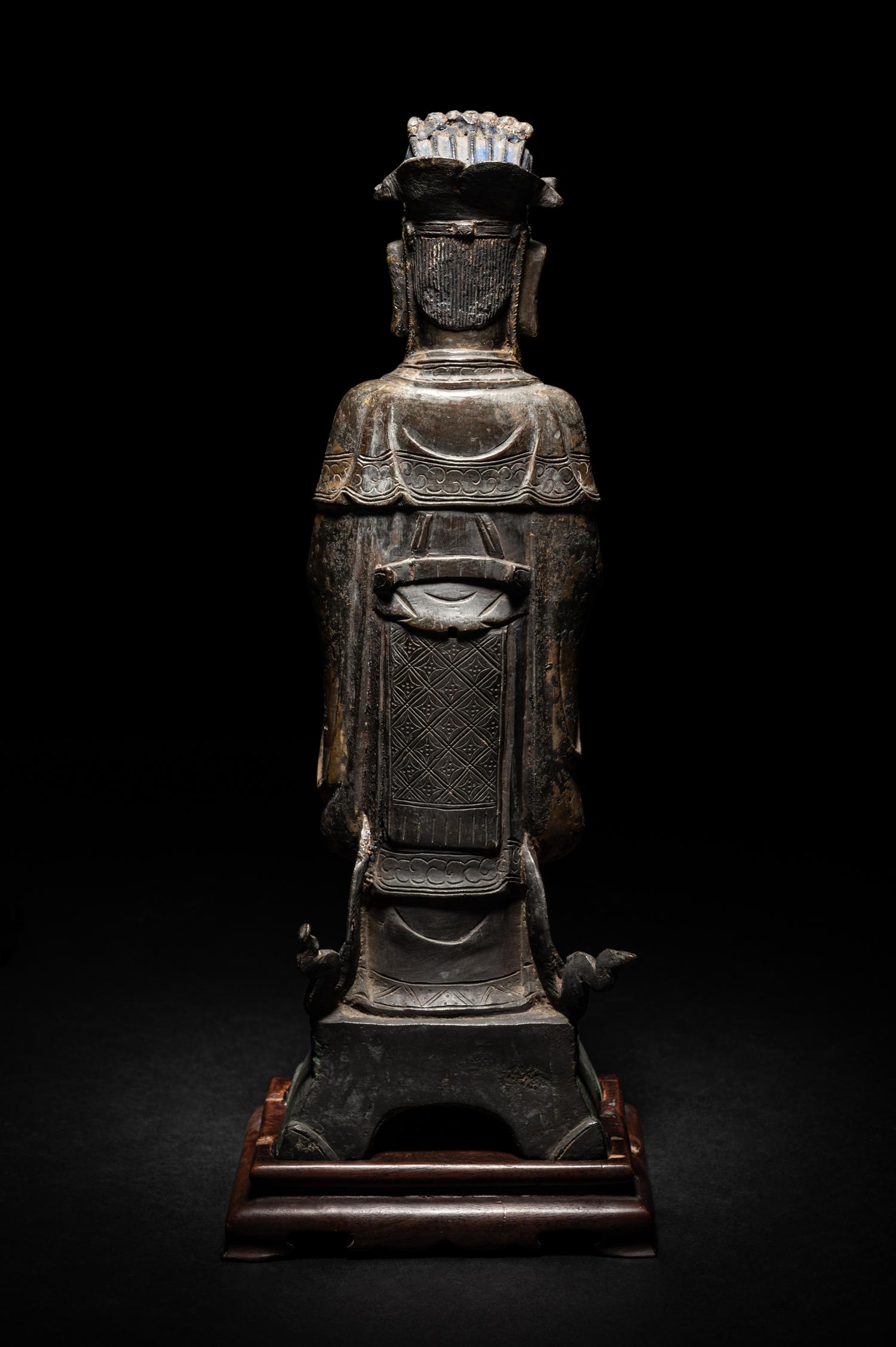 A Pair of Chinese Gilt Decorated Bronze Figures of Standing Officials